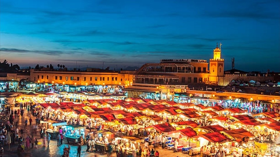 Famous Djemaa El Fna Square in early evening light, Marrakech,